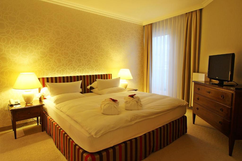 Postel nebo postele na pokoji v ubytování Hotel Ratswaage
