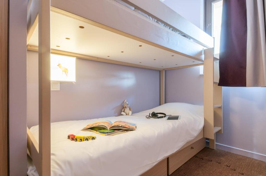 Postel nebo postele na pokoji v ubytování Résidence Pierre & Vacances Electra