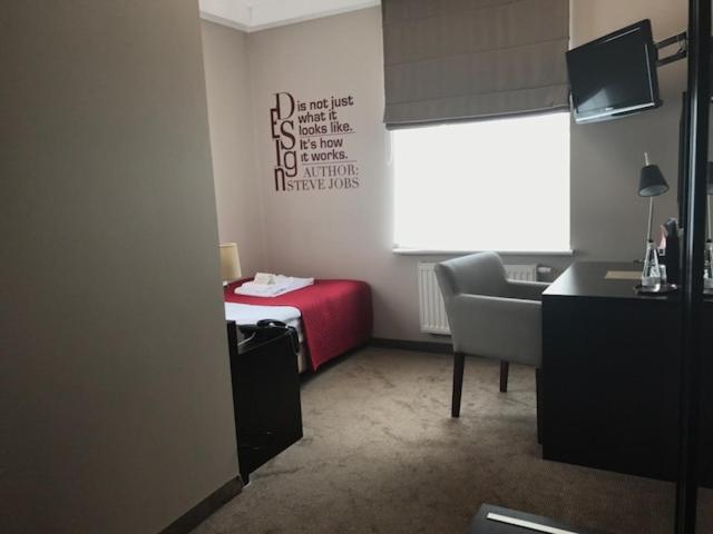 Postel nebo postele na pokoji v ubytování Comm Hotel Poznań Airport