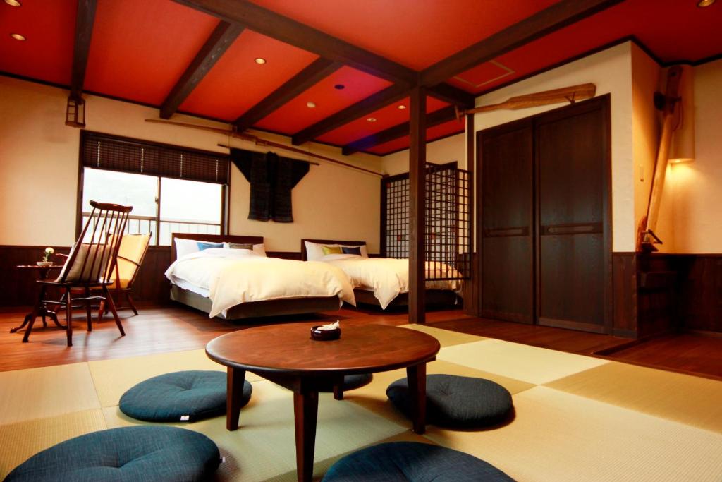 Postel nebo postele na pokoji v ubytování Tsuruga Sazanami Resort Chobei