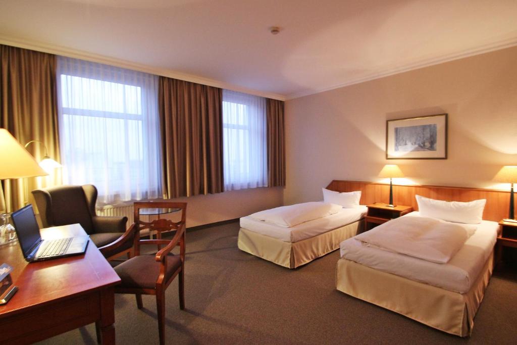 Postel nebo postele na pokoji v ubytování Hotel Ratswaage