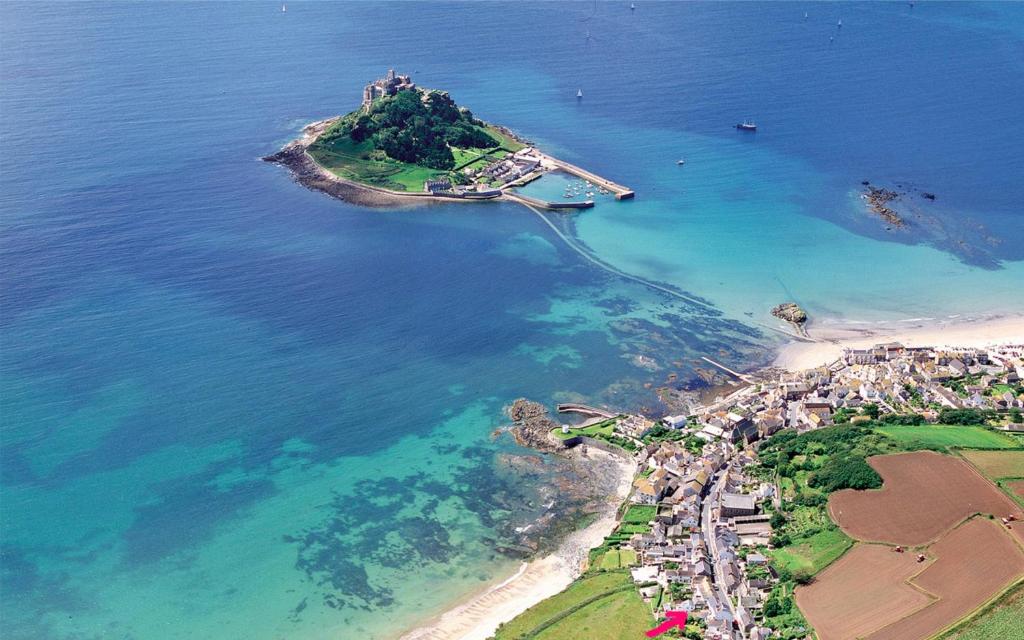 an aerial view of a small island in the ocean at Jowders Cottage in Marazion