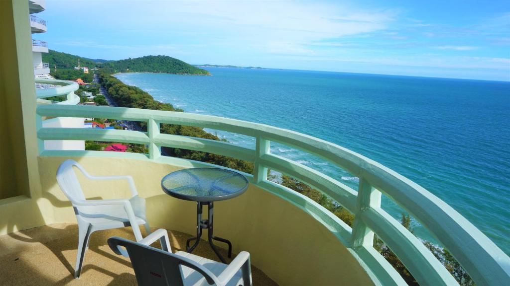 a balcony with a view of the ocean at VIP Condochain Rayong 427 in Ban Phe