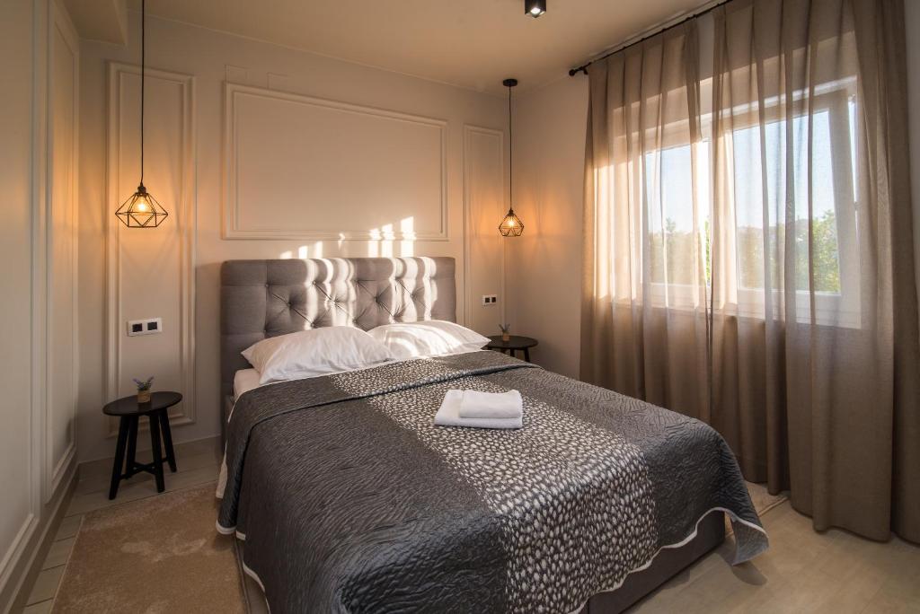 Postel nebo postele na pokoji v ubytování Luxury Apartment Imperia