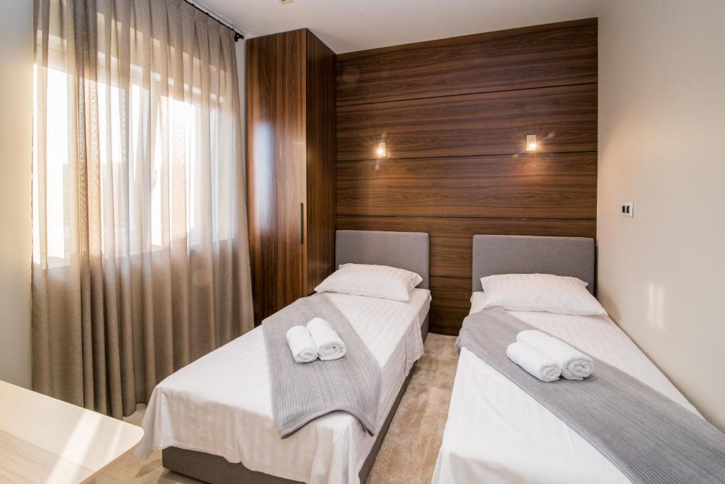 Postel nebo postele na pokoji v ubytování Luxury Apartment Imperia