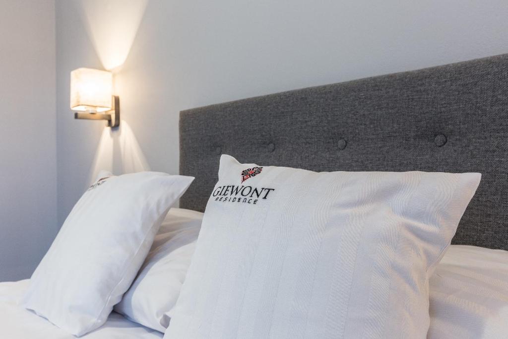 Posteľ alebo postele v izbe v ubytovaní Giewont Residence