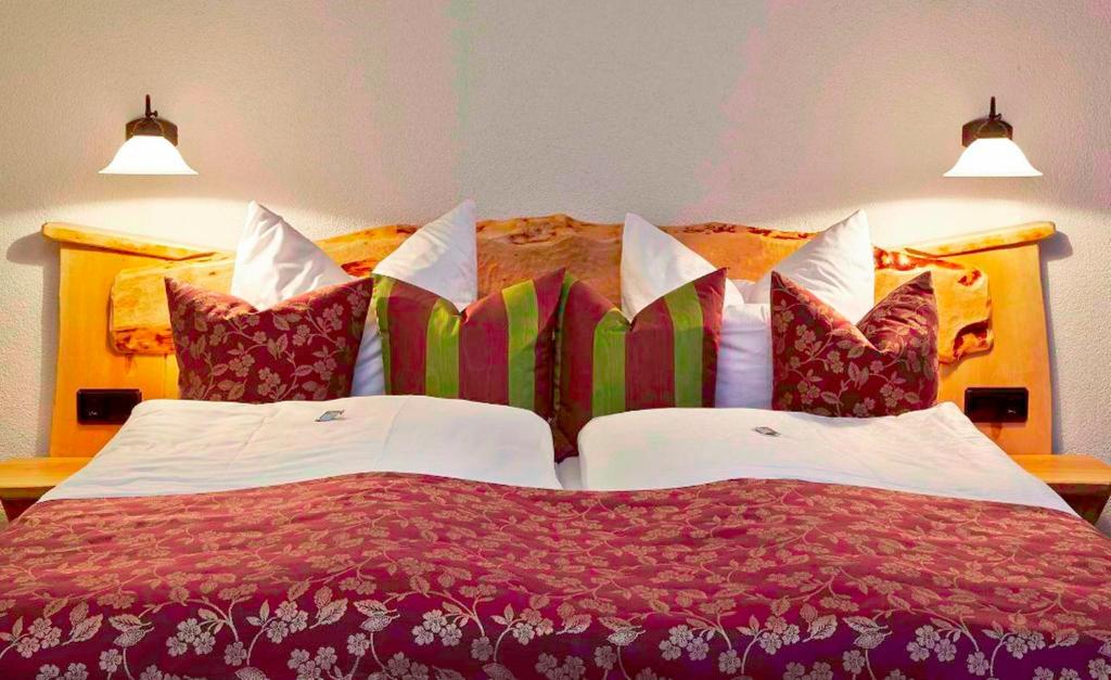 Postel nebo postele na pokoji v ubytování Reit-und Sporthotel Nordmann