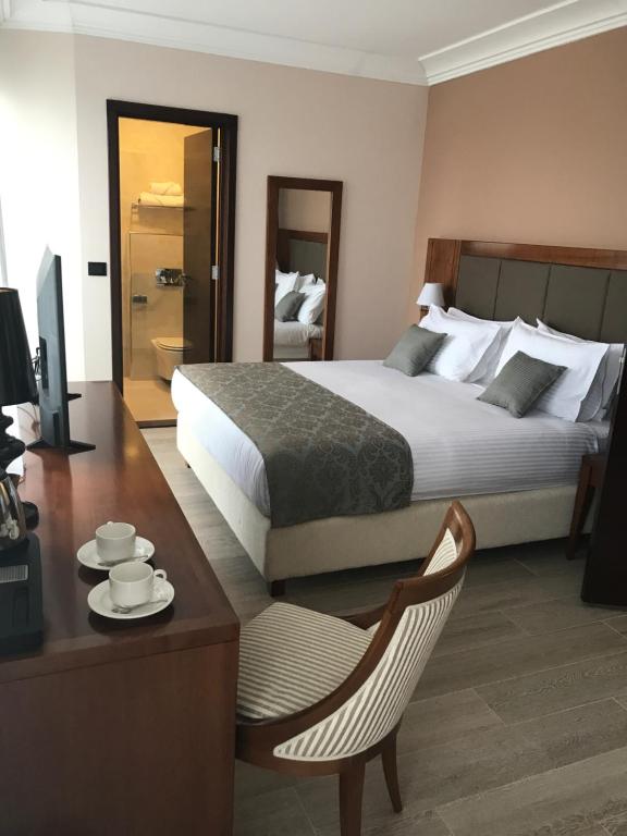 Postel nebo postele na pokoji v ubytování Xenon Hotel & SPA