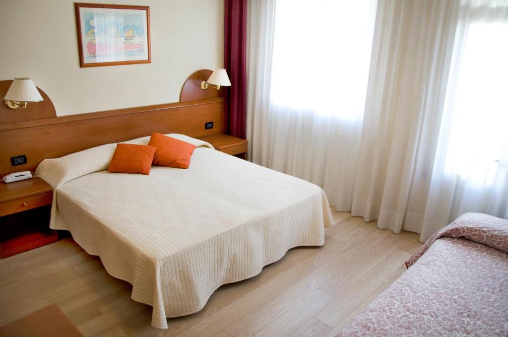 Postel nebo postele na pokoji v ubytování Hotel Sole