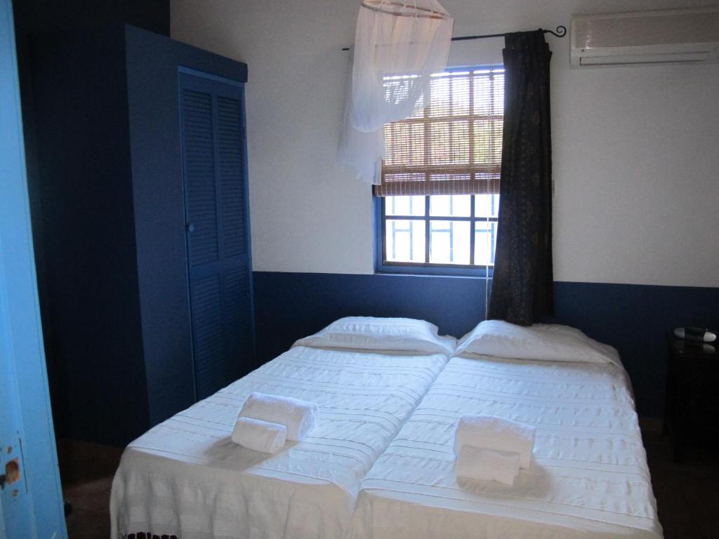 Postel nebo postele na pokoji v ubytování Caribbean Chillout Apartments
