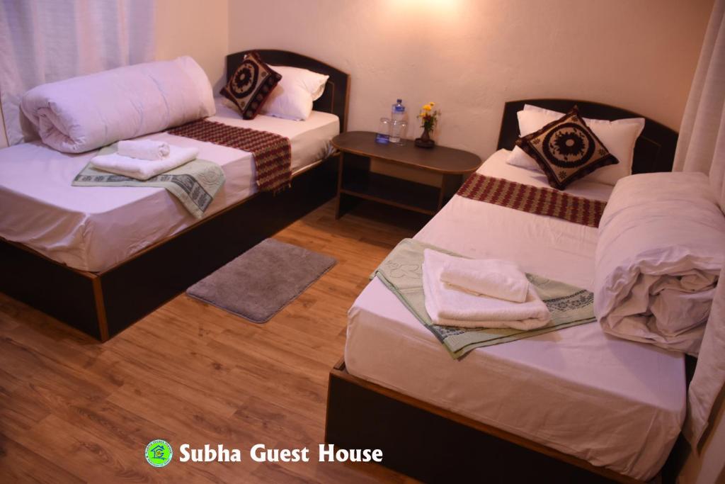 Postel nebo postele na pokoji v ubytování Subha Guest House