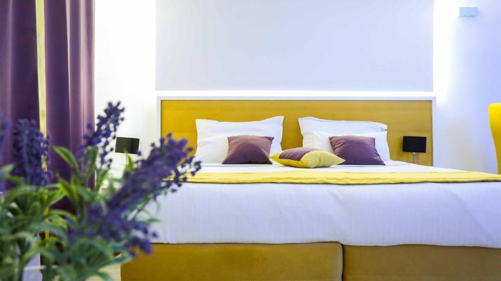 Postel nebo postele na pokoji v ubytování Hotel Boutique Libris