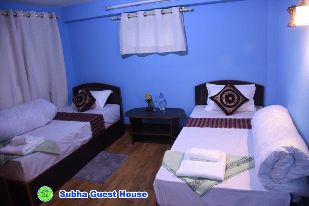 Postel nebo postele na pokoji v ubytování Subha Guest House
