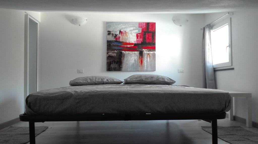 מיטה או מיטות בחדר ב-Casa vacanza S'Istella iun Q2451