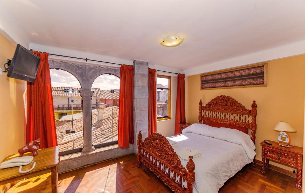 Postel nebo postele na pokoji v ubytování Fuente de Agua Hotel