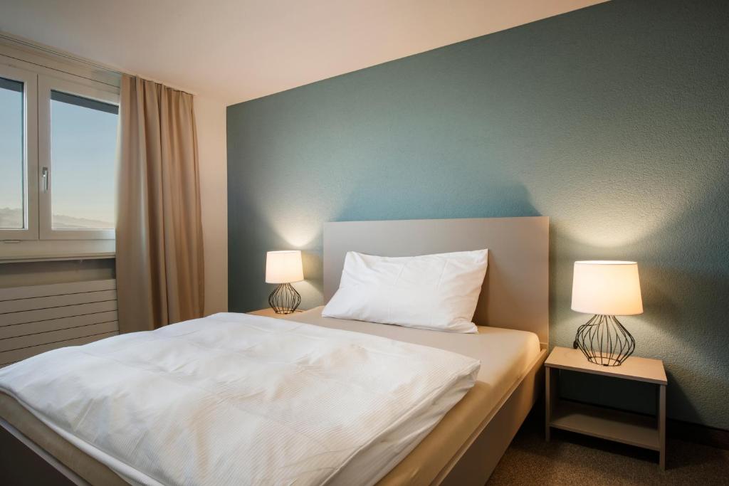 Postel nebo postele na pokoji v ubytování Le Domaine (Swiss Lodge)