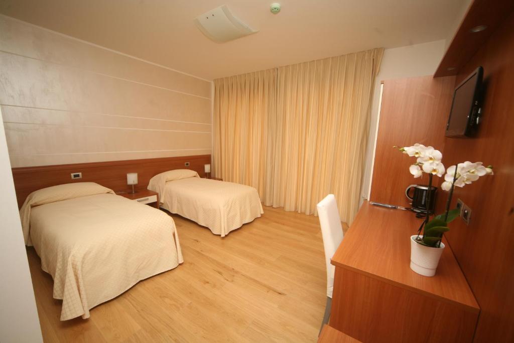 Postel nebo postele na pokoji v ubytování Resort Monviso