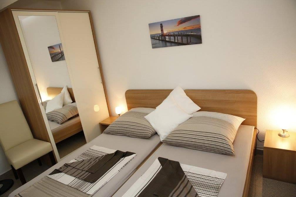 Postel nebo postele na pokoji v ubytování Apartments Šimić