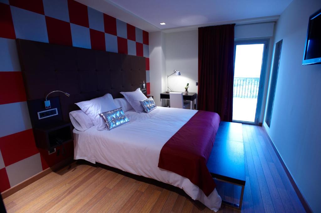 Postel nebo postele na pokoji v ubytování Hotel Eguren Ugarte