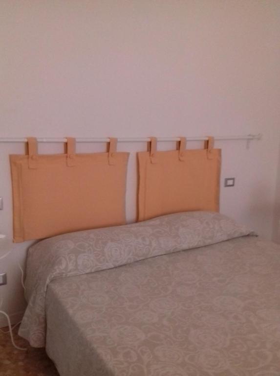 Postel nebo postele na pokoji v ubytování Gino's House