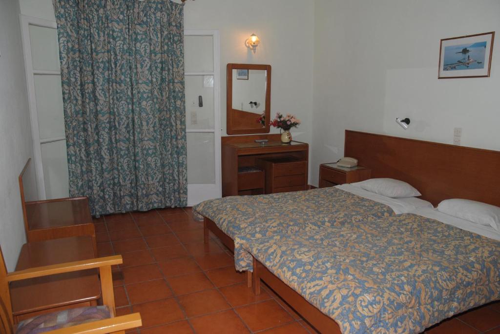 Postel nebo postele na pokoji v ubytování SeaBird Hotel