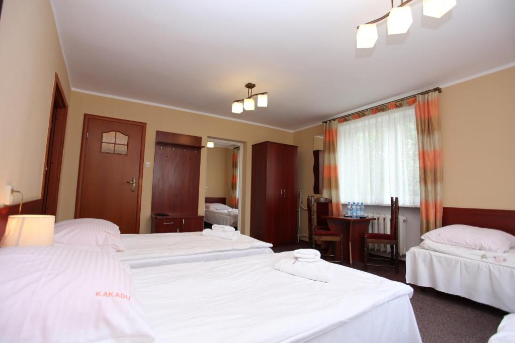 Posteľ alebo postele v izbe v ubytovaní Hotel Kakadu