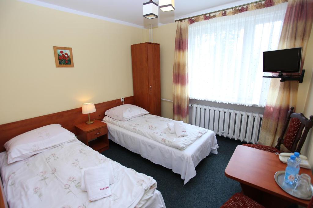 Posteľ alebo postele v izbe v ubytovaní Hotel Kakadu