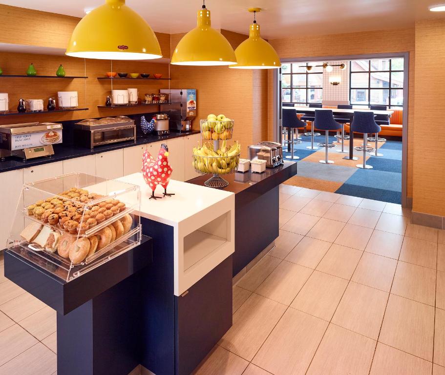 a bakery with a display of pastries on a counter at LivINN Hotel Minneapolis South / Burnsville in Burnsville