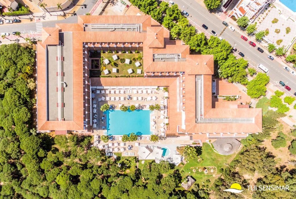 an overhead view of a building with a swimming pool at TUI Blue Isla Cristina Palace - Adults Recommended in Isla Cristina