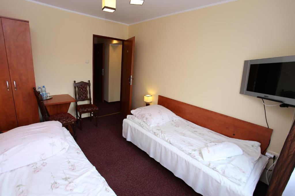 Posteľ alebo postele v izbe v ubytovaní Hotel Kakadu