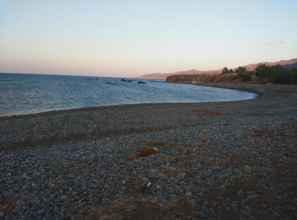 a rocky beach with the ocean in the background at Pomos Harbourbiew Villa in Pomos