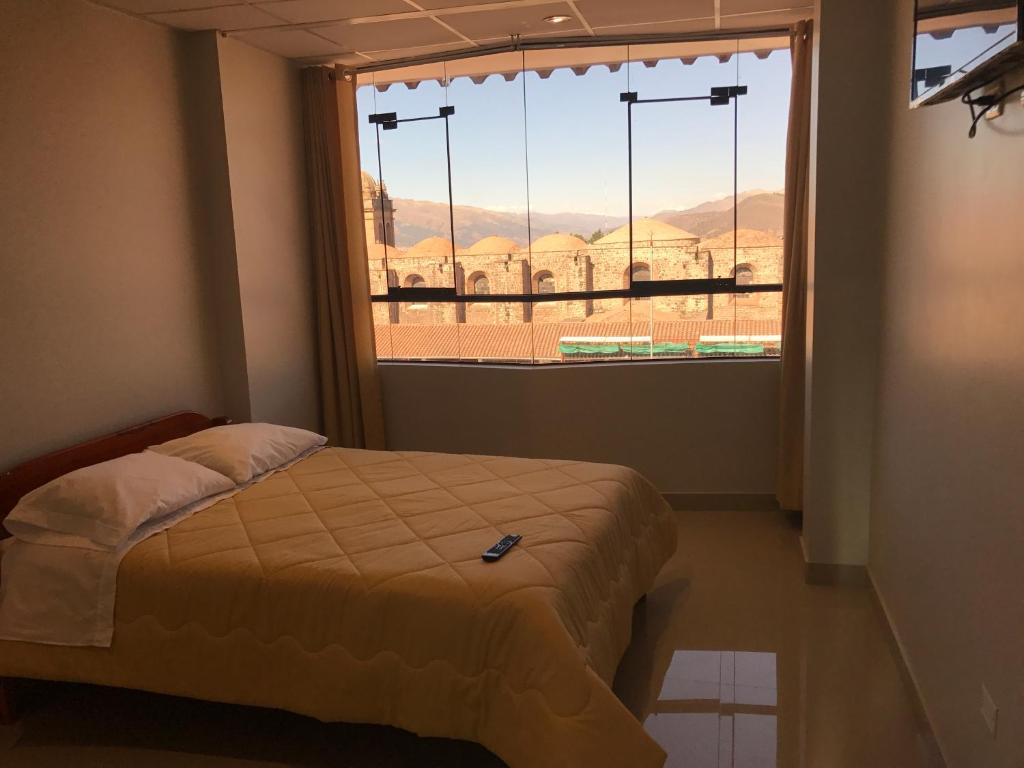 Postel nebo postele na pokoji v ubytování Edmoli Casa Hospedaje