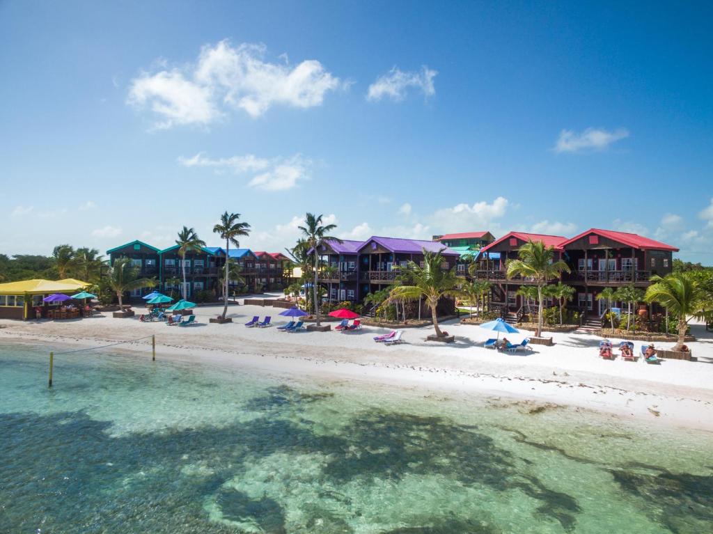 an aerial view of a beach with houses and the water at X'tan Ha- The Waterfront in San Pedro