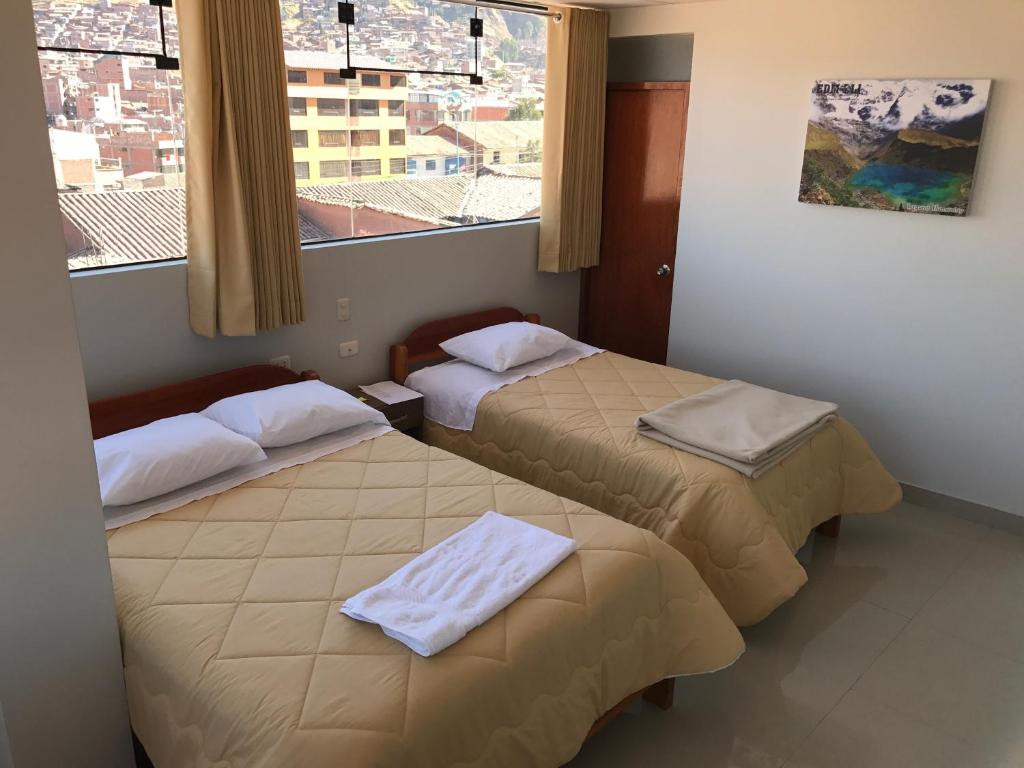 Postel nebo postele na pokoji v ubytování Edmoli Casa Hospedaje
