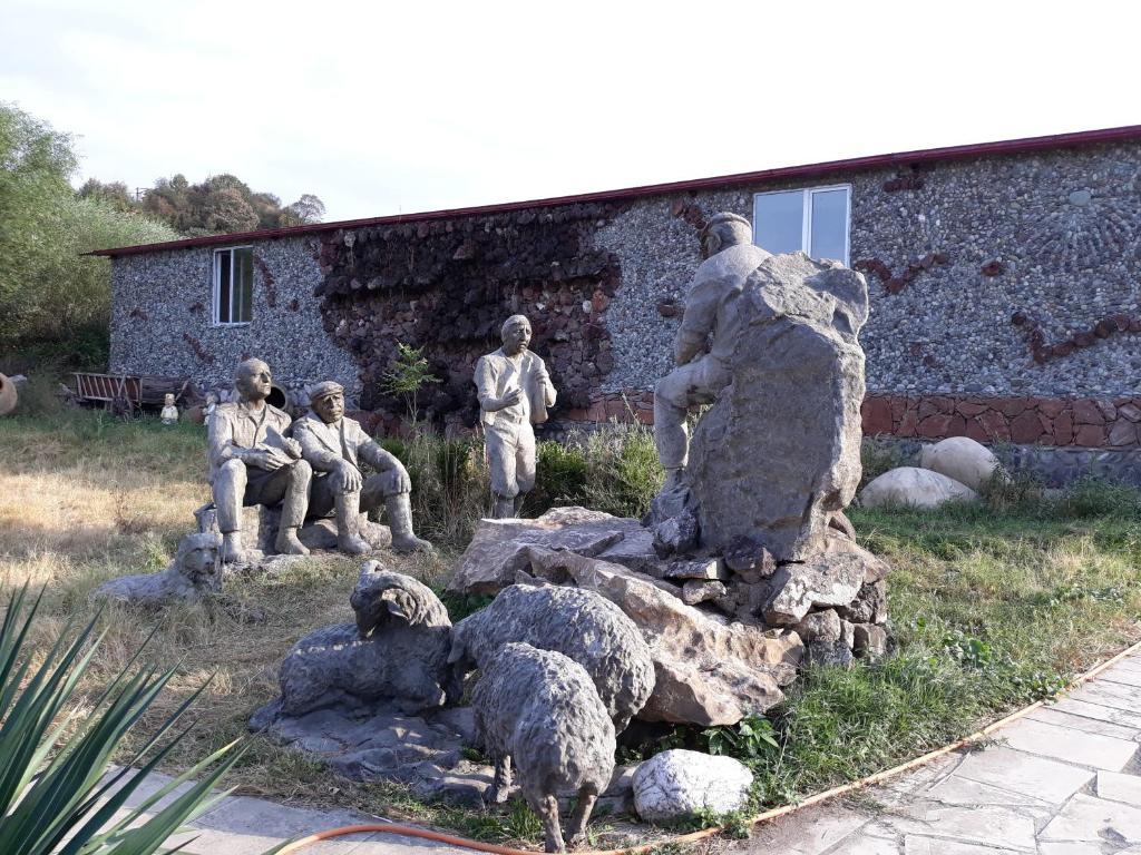a statue of a group of people and sheep at Hotel Skazka in Ijevan