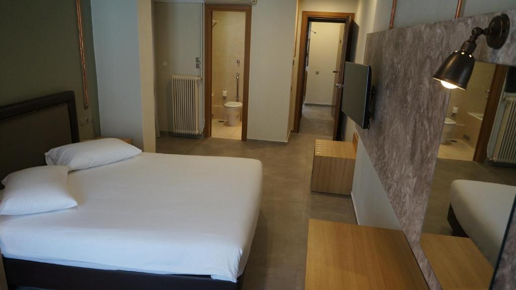 Postel nebo postele na pokoji v ubytování Kastalia Boutique Hotel