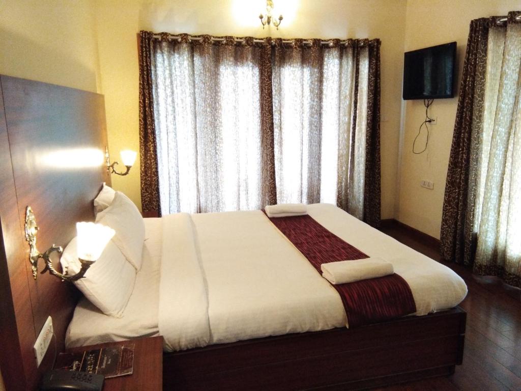 Postel nebo postele na pokoji v ubytování Berry Hills Resort