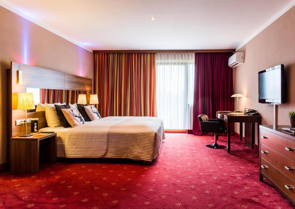 Posteľ alebo postele v izbe v ubytovaní Hotel Salzburg