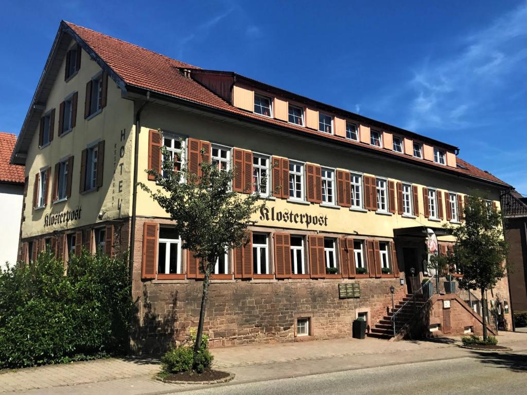 a large building with a brick building at Hotel Klosterpost in Maulbronn