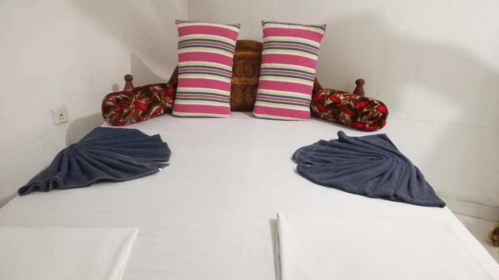 Postel nebo postele na pokoji v ubytování Kalana Homestay