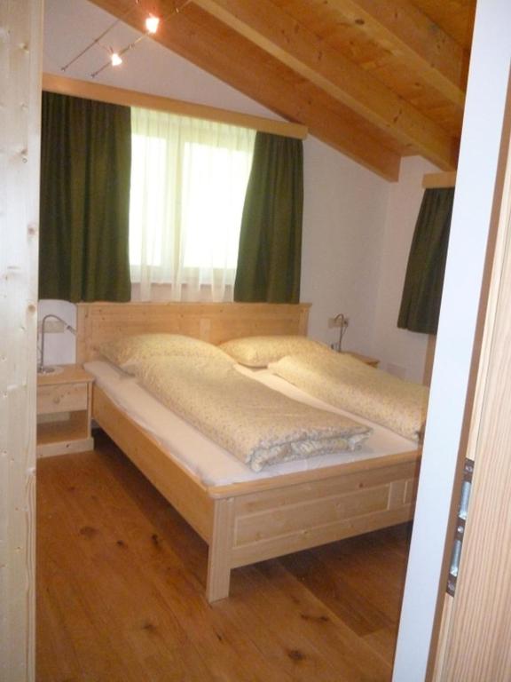 Postel nebo postele na pokoji v ubytování Isidorhof