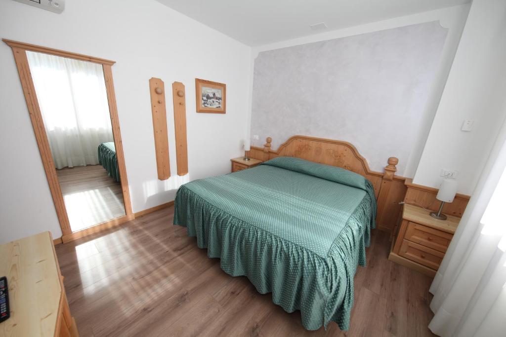 Postel nebo postele na pokoji v ubytování Al Benvenuto Hotel & Restaurant