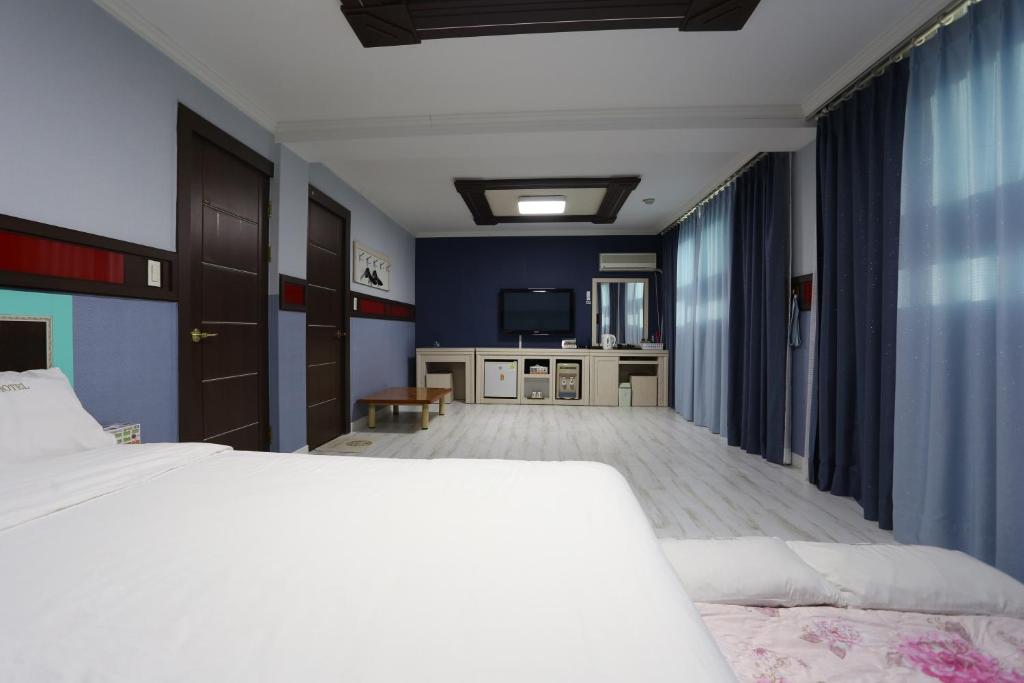 Postel nebo postele na pokoji v ubytování Paradaise Motel