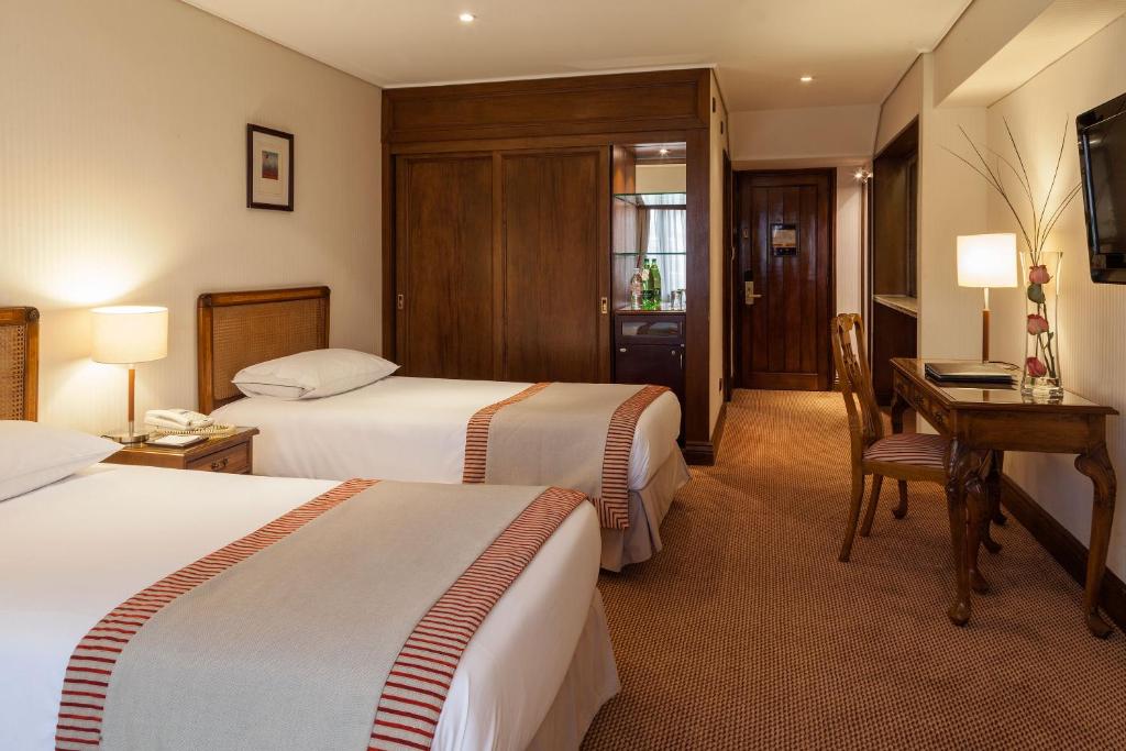 Postel nebo postele na pokoji v ubytování Hotel Plaza San Francisco
