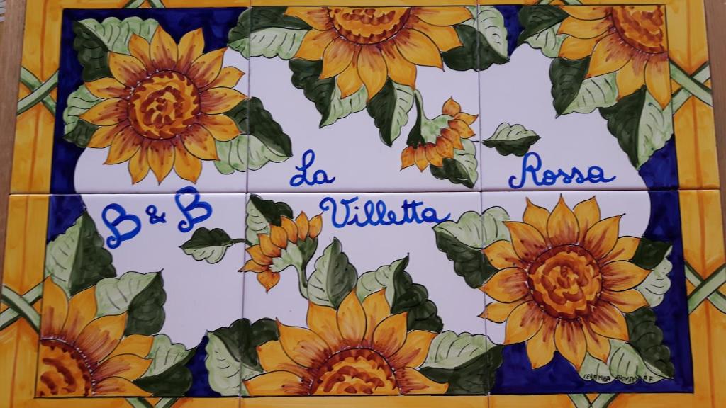 uma imagem de girassóis numa parede de azulejos em B&B La villetta rossa em Anzio