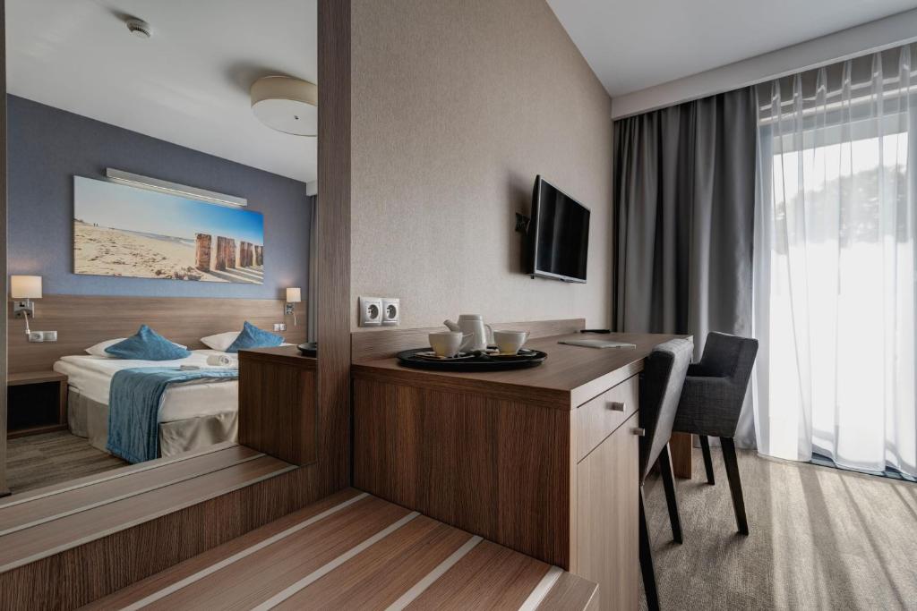 TV a/nebo společenská místnost v ubytování WIND Hotel