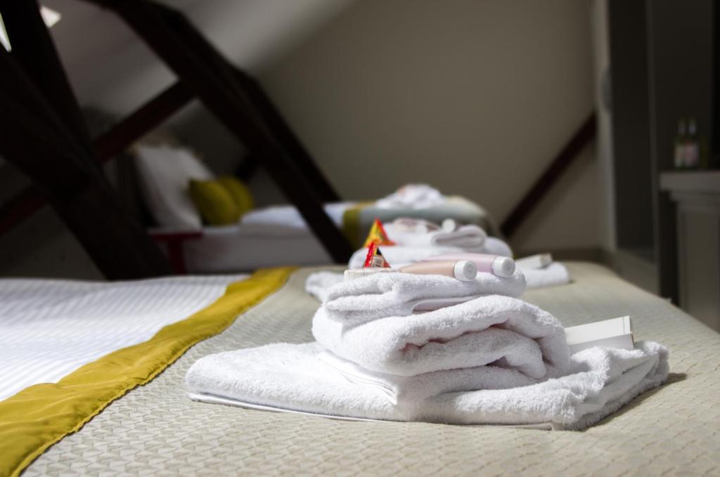 Postel nebo postele na pokoji v ubytování Hotel Kocour