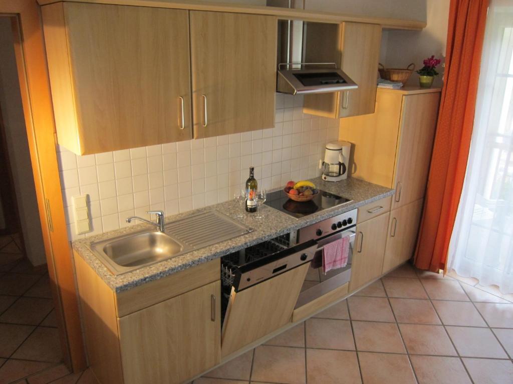 Kuchyň nebo kuchyňský kout v ubytování Appartement Millennium