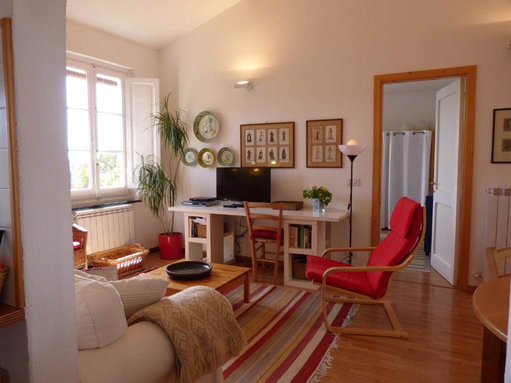 a living room with a couch and a table at Garden Lodge in Chiavari