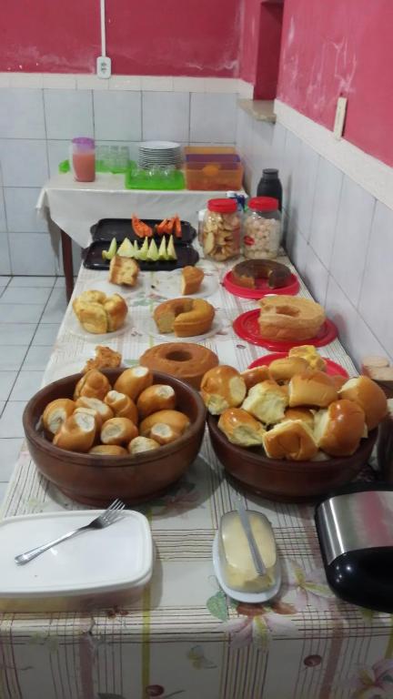 a table with three bowls of food on it at Hotel Italia in Timon